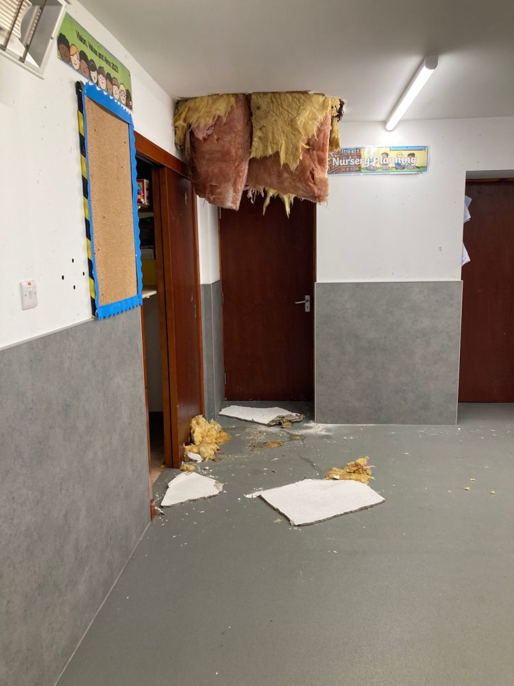 Hallway with collapsed ceiling above 'Nursery Planning' door.