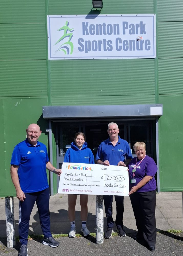 Representatives from Kenton Park Sports Centre and Asda Gosforth’s Community and Customer Champion holding a £12,200 Asda Foundation grant cheque outside the sports centre.
