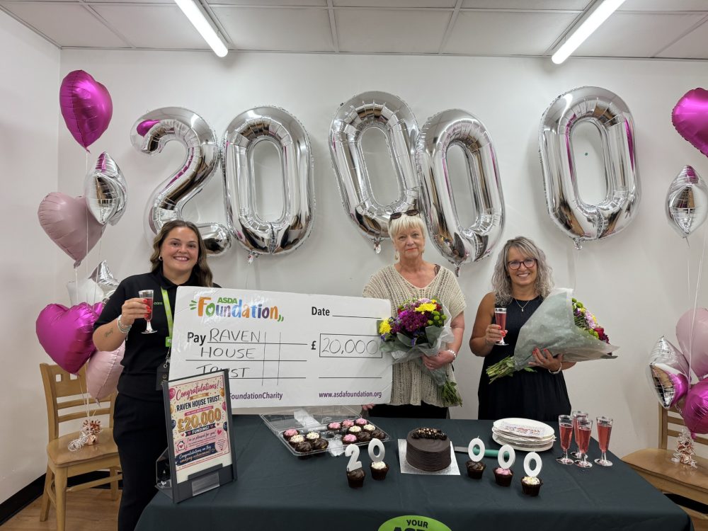 Raven House Trust team members celebrate a £20,000 Local Community Spaces Fund award.