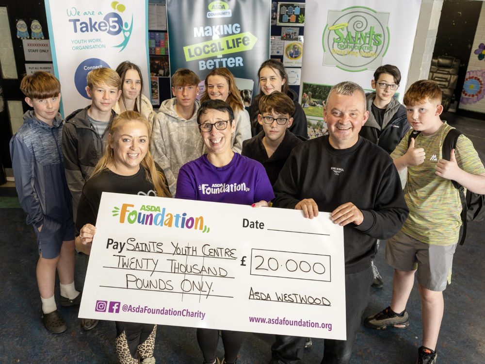 Young people and staff at Saints Youth Centre celebrate a £20,000 Asda Foundation grant award.